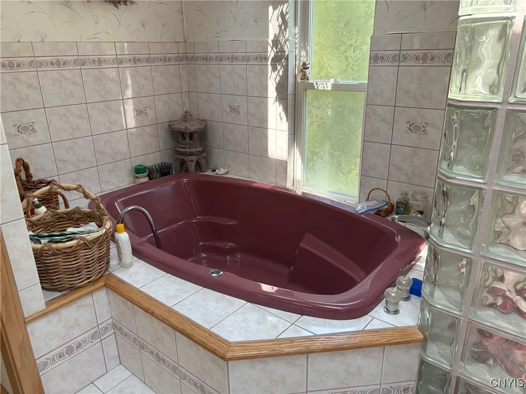 2nd floor full bath with Jacuzzi tub and separate cubed glass enclosed shower