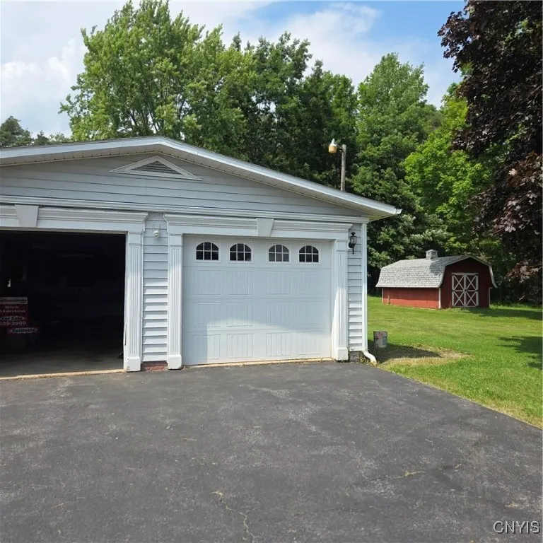 Big attached garage. Could fit 4 cars and work shop.