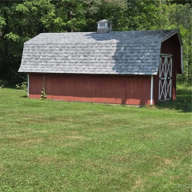Large Shed with concrete floor and electricity.