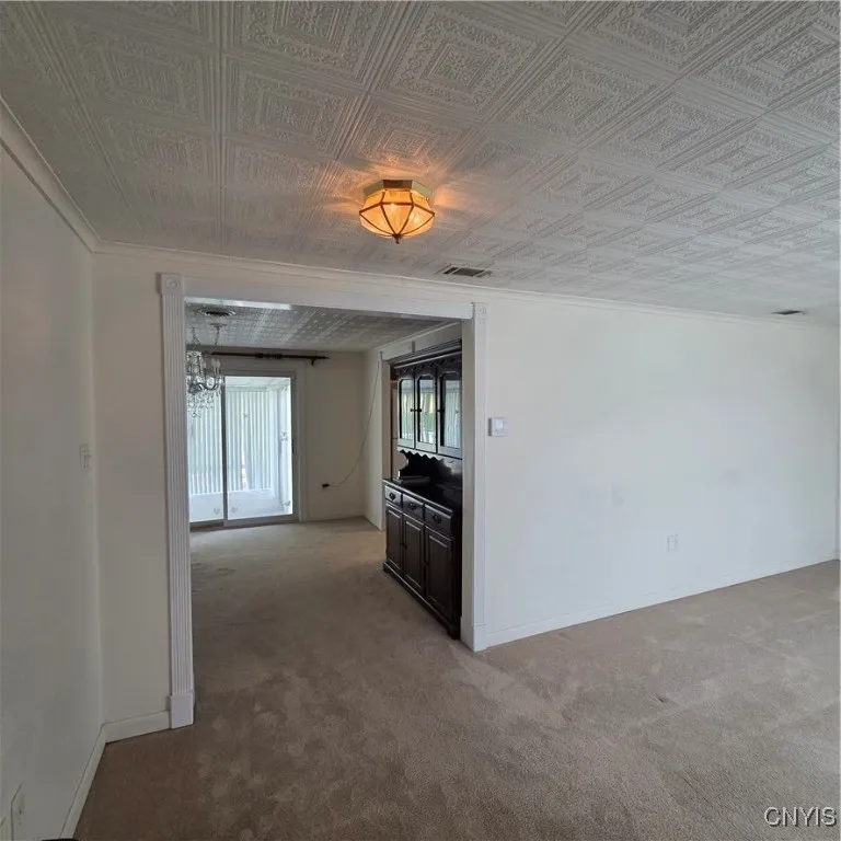 Looking thru Living Room into Dining Room and into 3 Season Room