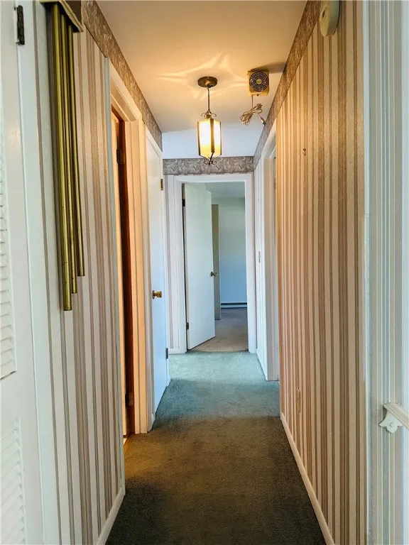 The second floor hallway leading to the three bedrooms and full bath.