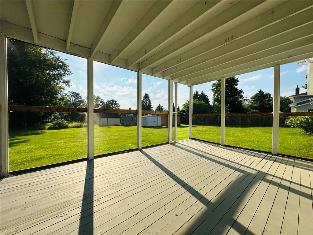 The first floor screened porch overlooking the back yard.