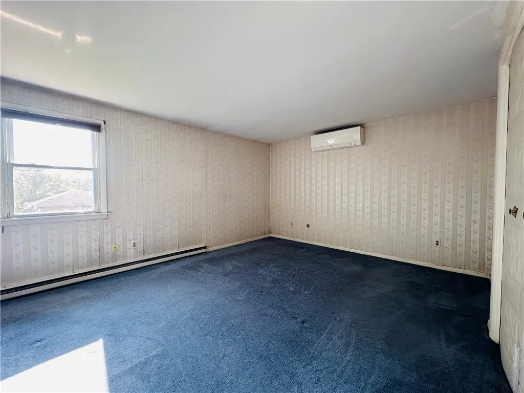 The primary bedroom with half bath.
