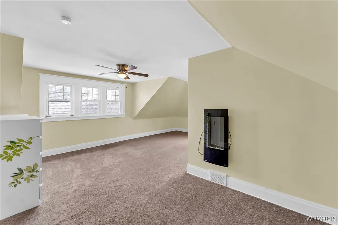 Upstairs bedroom 1. This room is huge! Create a reading nook and enjoy your electric fireplace in the winter.