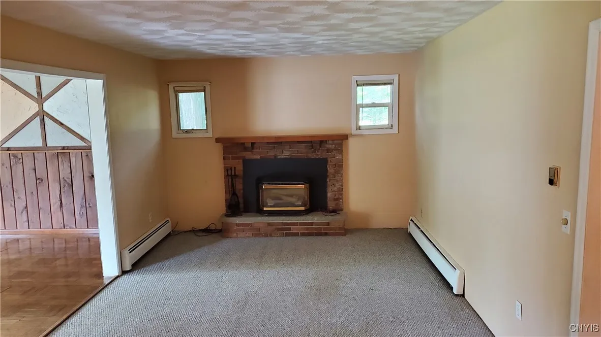    Kitchen overlooks the family room with gas fireplace.