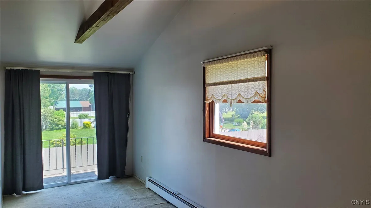   Primary bedroom has a small deck off the glass slider.