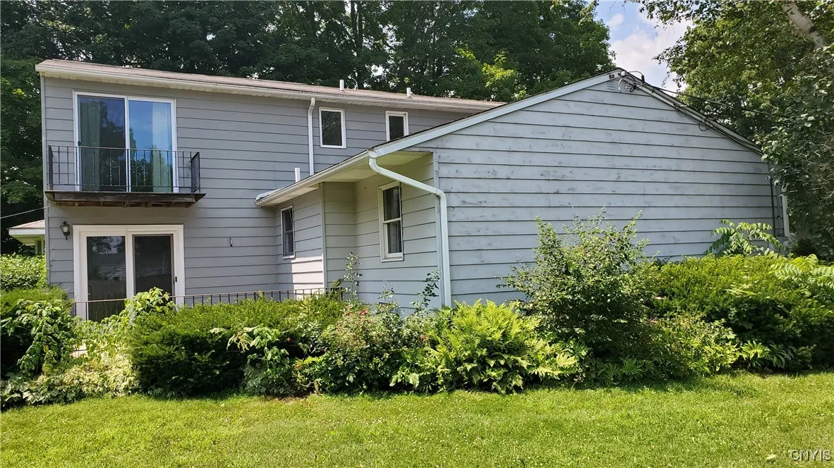  Left  side of home.  There is a patio off the lower glass slider.