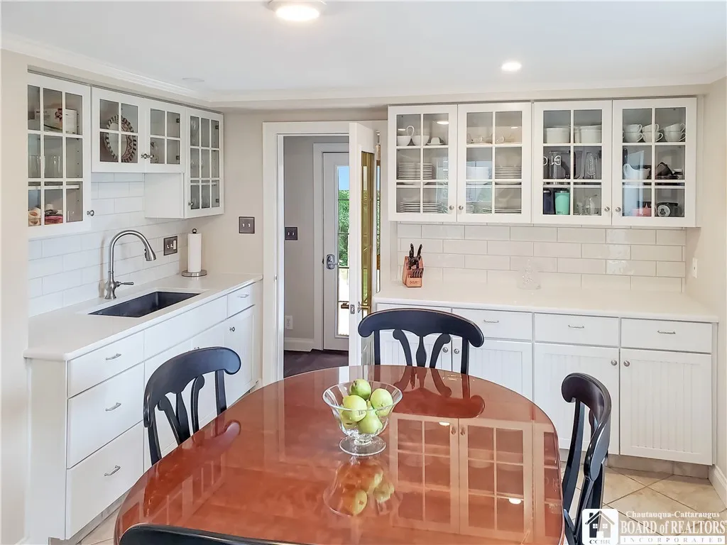 Kitchen with Tiled Floors   Glass Cupboards