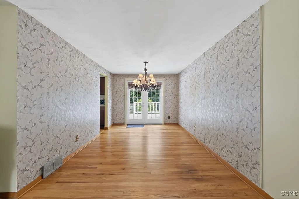 Formal dining room with double doors to the back deck