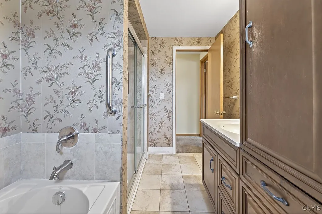 Full bath upstairs w/ step in shower and seperate tub