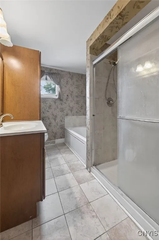 Full bath upstairs w/ step in shower and seperate tub