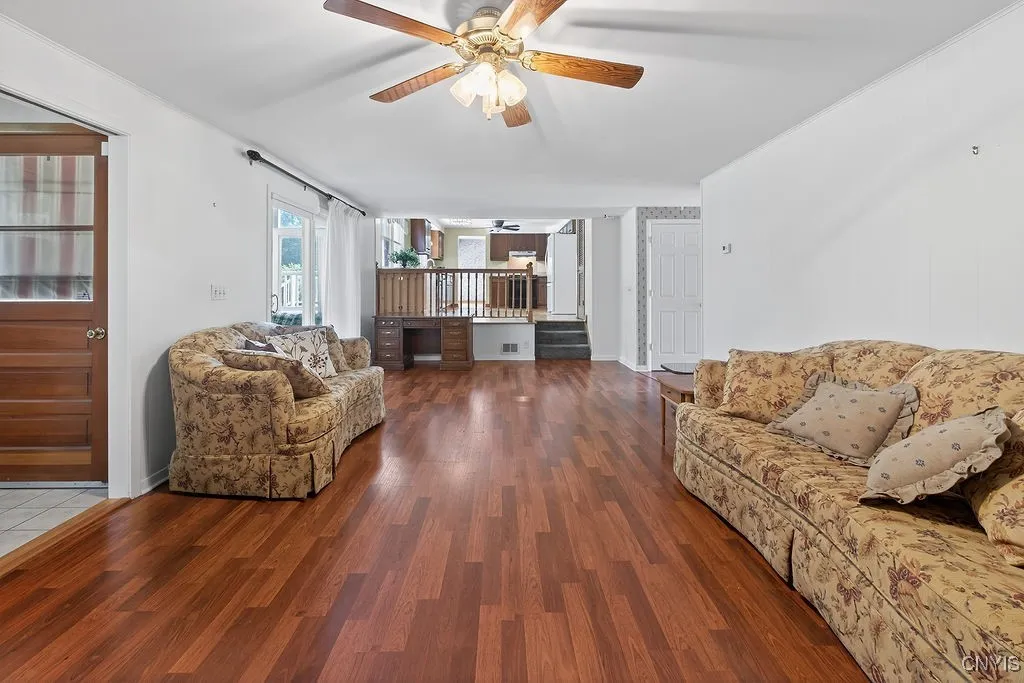 Back family room with access to florida room and first floor laundry/half bath