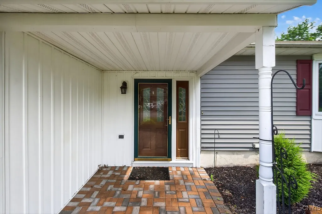 Covered porch with low maintenance landscaping