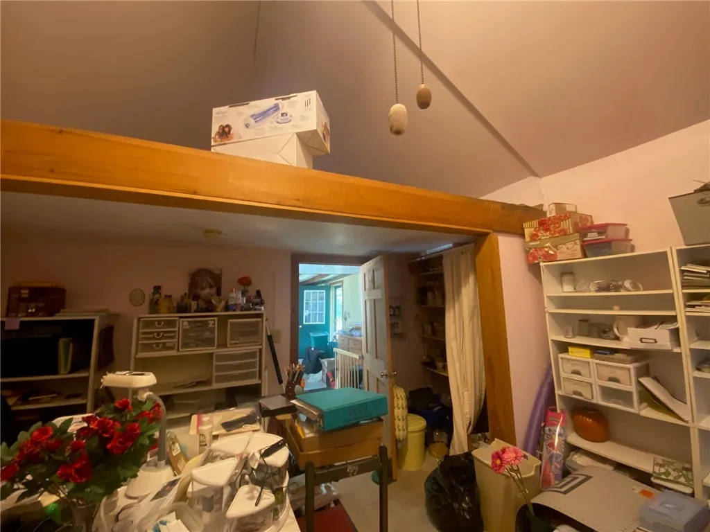 Craft room with loft. Side entry door in the background.