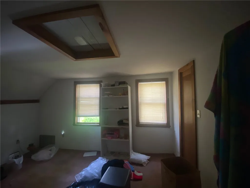 2nd floor bedroom with scuttle access to the attic space.