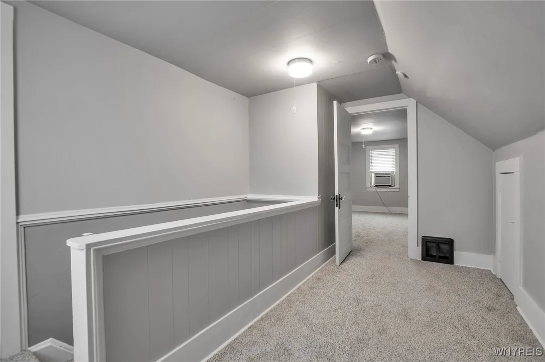 Upstairs landing w/ built-in drawers and attic access.