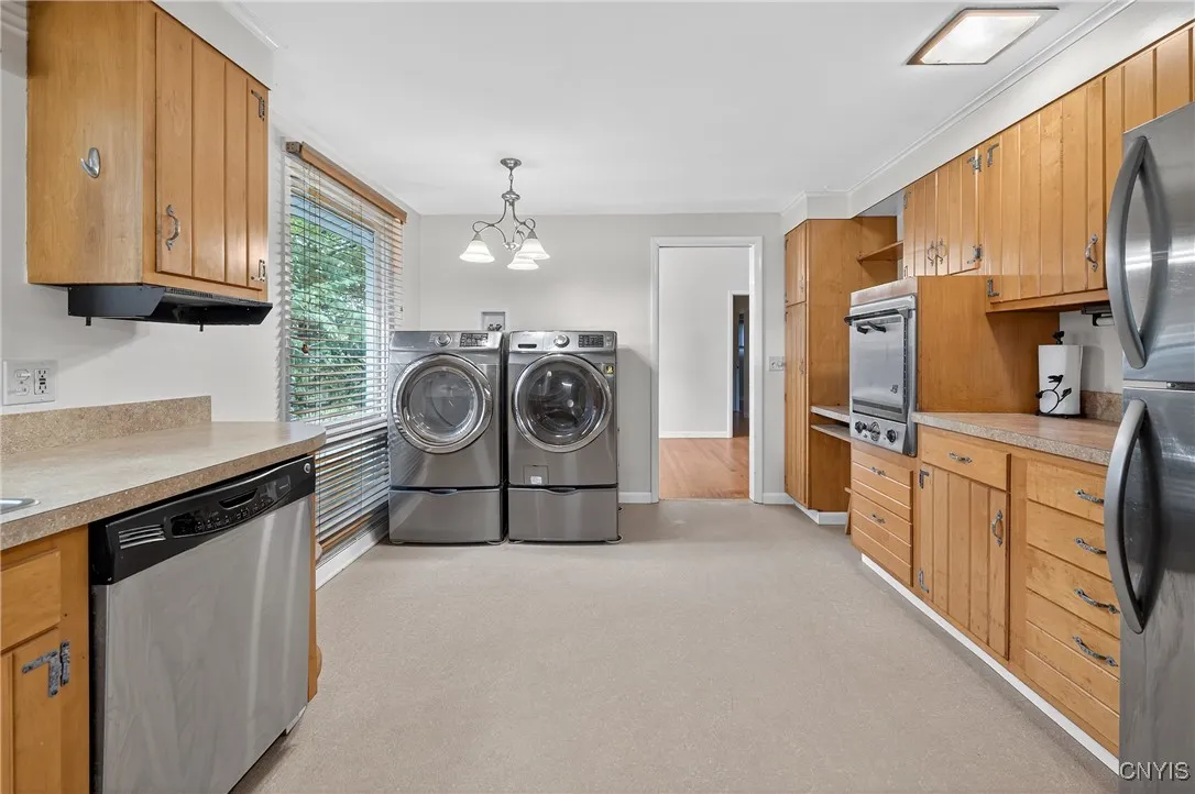 Kitchen view from the garage entrance.  Laundry can be moved back downstairs