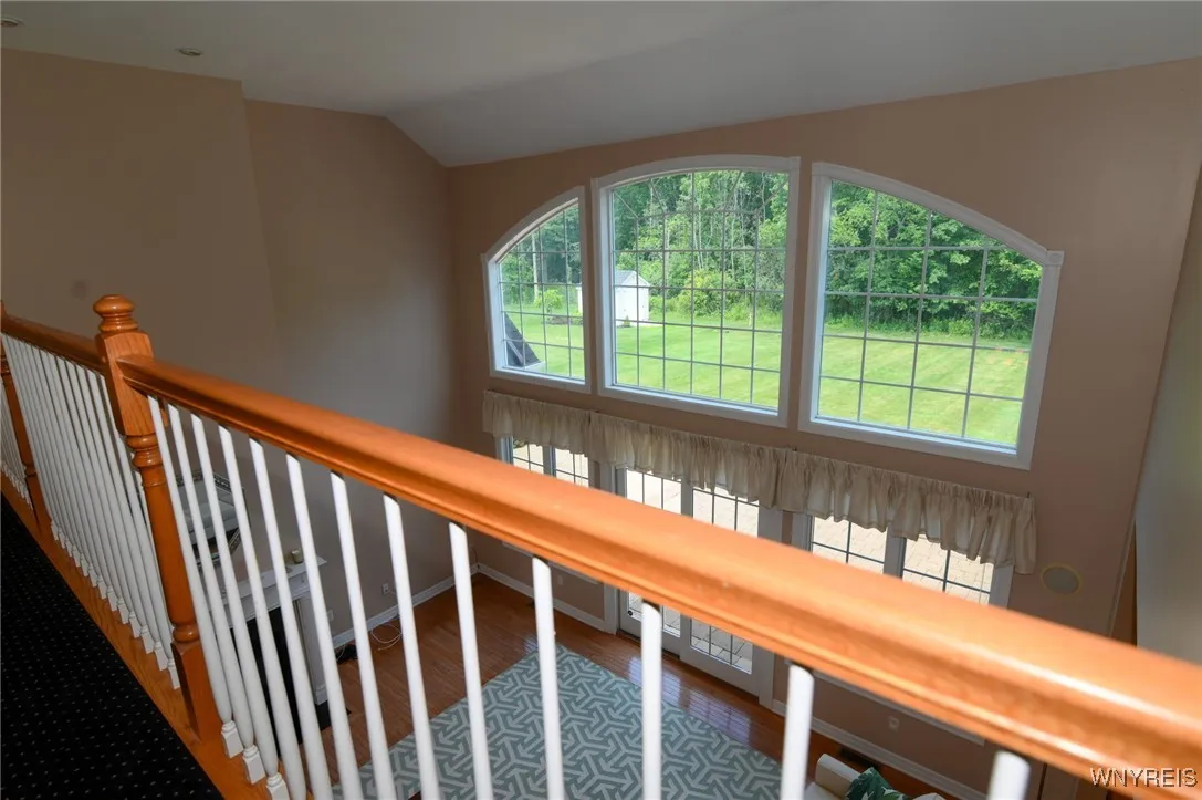 Fantastic view of the living room and the window wall from the loft
