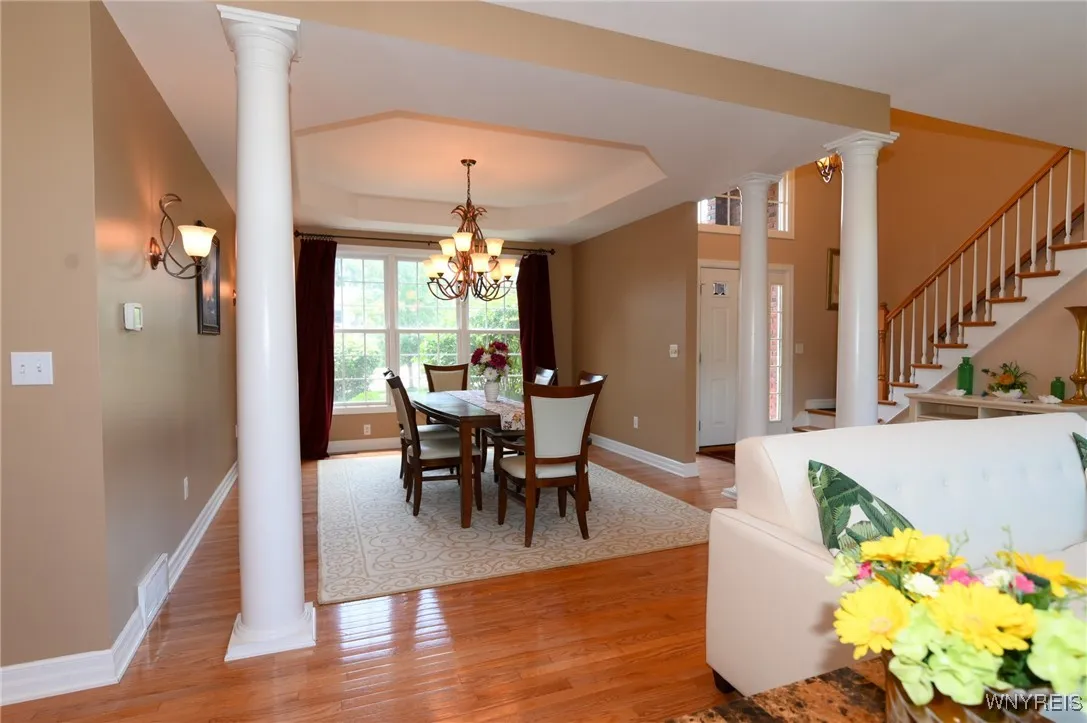 Dining room off the main entrance and stairs to second floor.