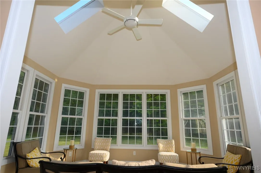 Sunroom showing vaulted ceiling using a wide-angle lens.