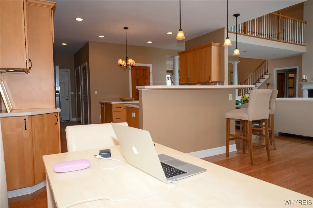 Dining area off the kitchen, counter with chairs for that cup of coffee or snack.