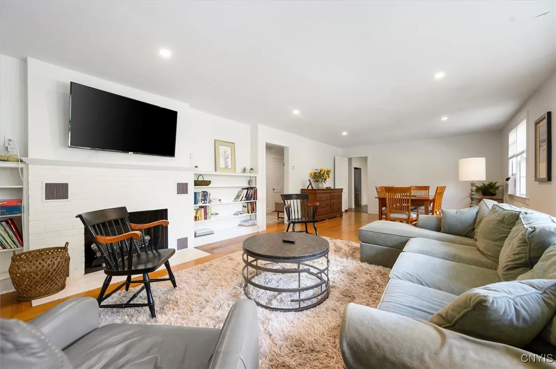 LR w/fireplace, bookshelves and nice hardwoods -