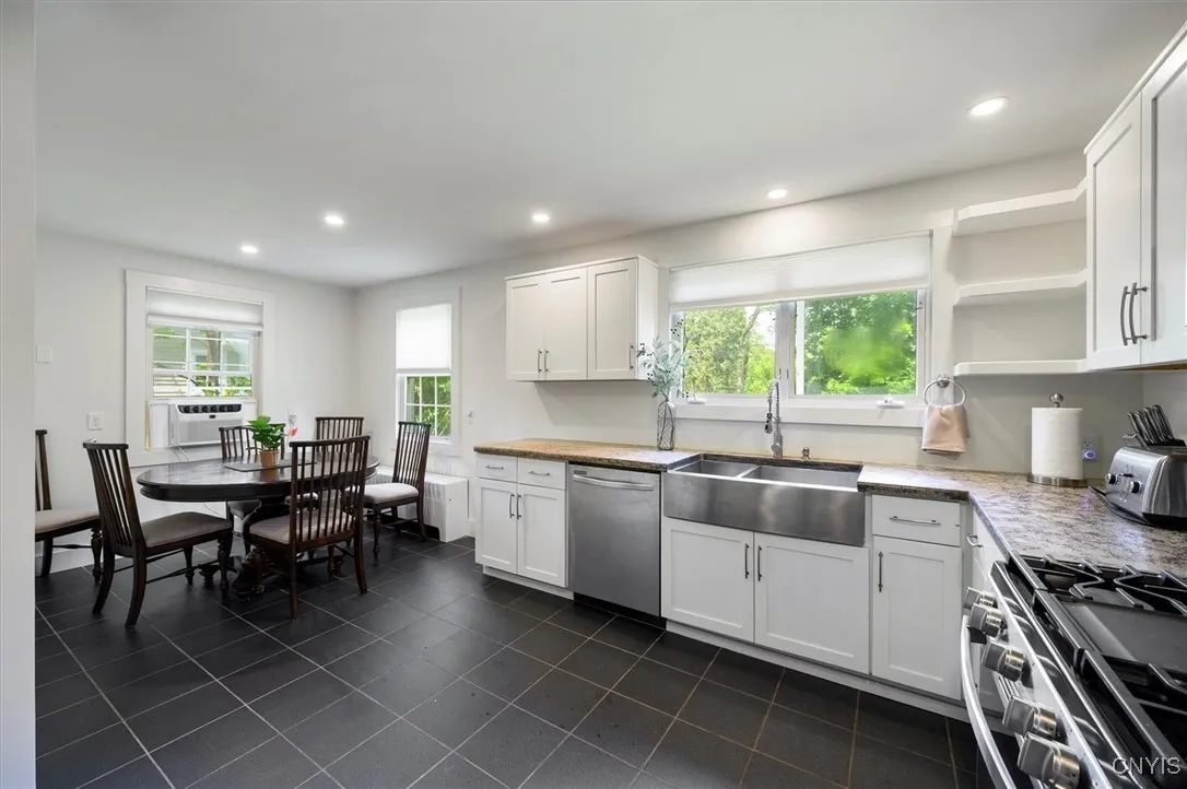 Spacious eat in kitchen with access to two car garage, laundry & pantry