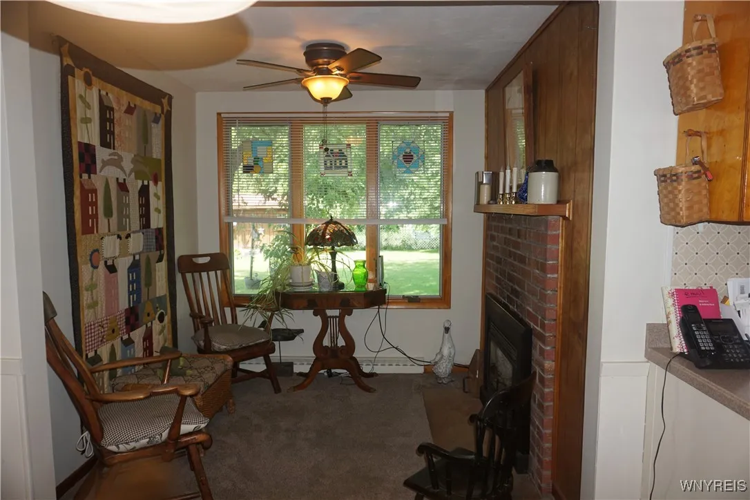 Other room: features a gas fireplace & is next to the dining room & looks out to the backyard.