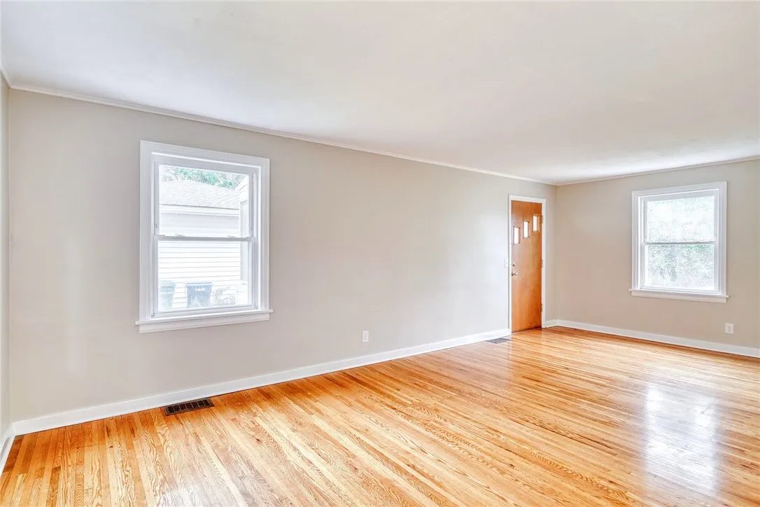 Living room with gleaming hard wood floors