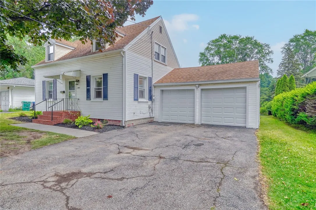 Double wide driveway with 2 car garage