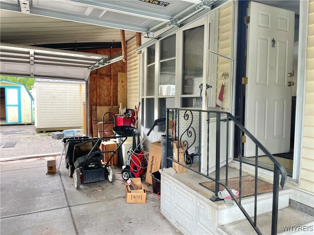 car port converted to garage with overhead doors at each end.
