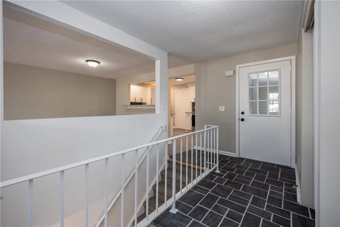 Great foyer entry area - stairs to finished lower level
