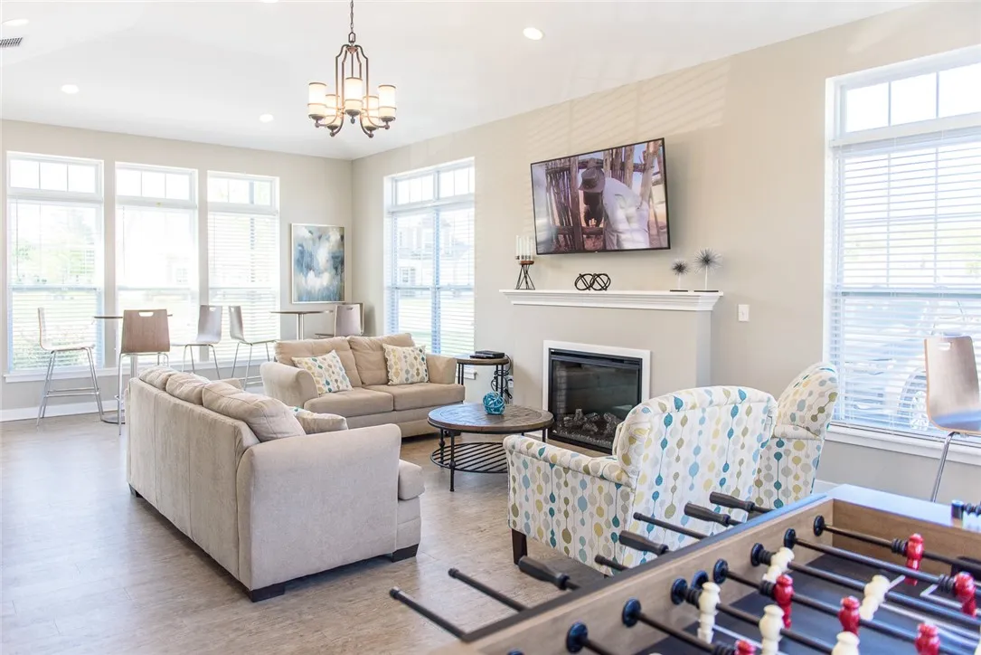 View of Community Room with fireplace and foosball table