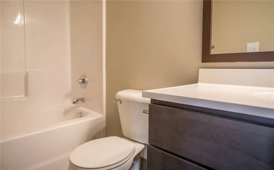 Typical second full bathroom with shower/tub combo