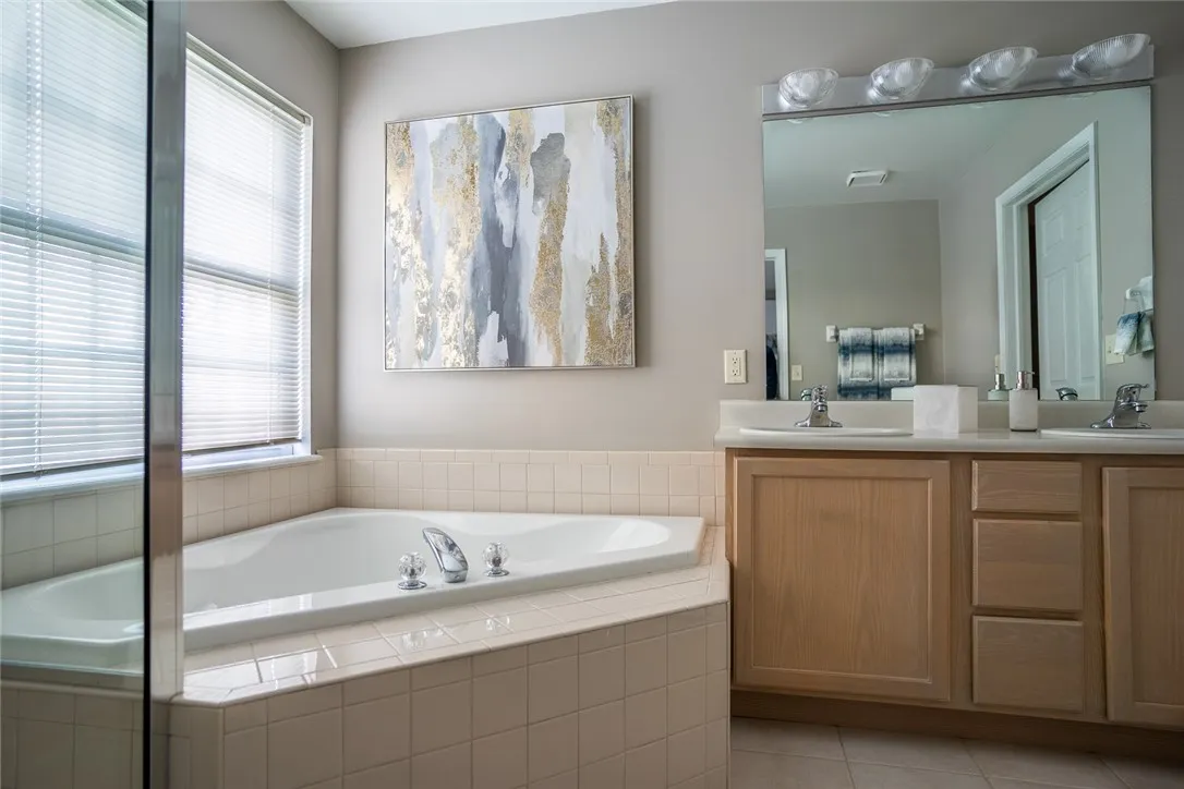 Typical full bath with roman soaking tub and step-in shower
