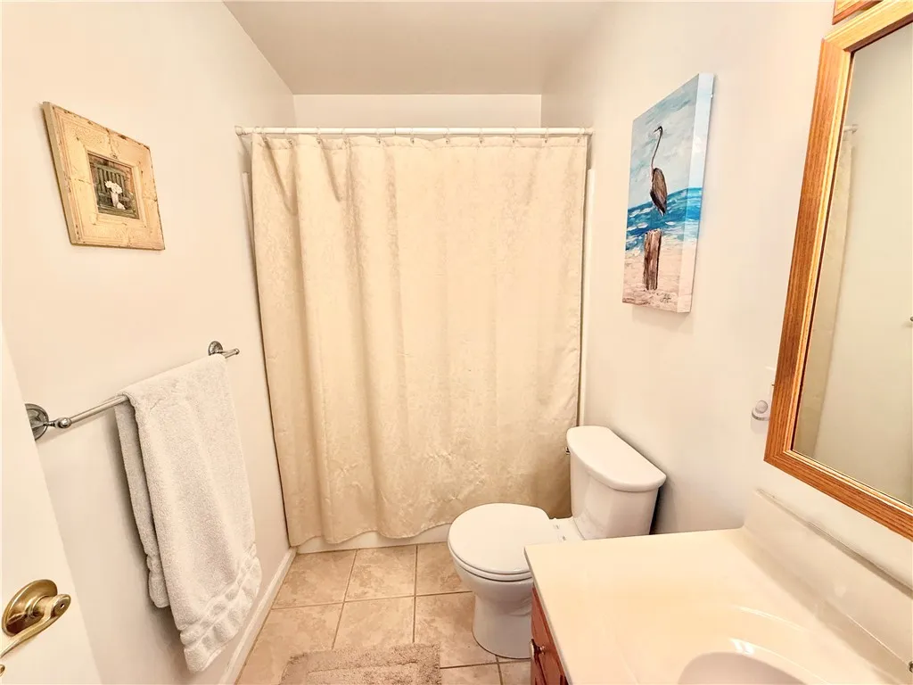 This bath has a tub as well as a shower.