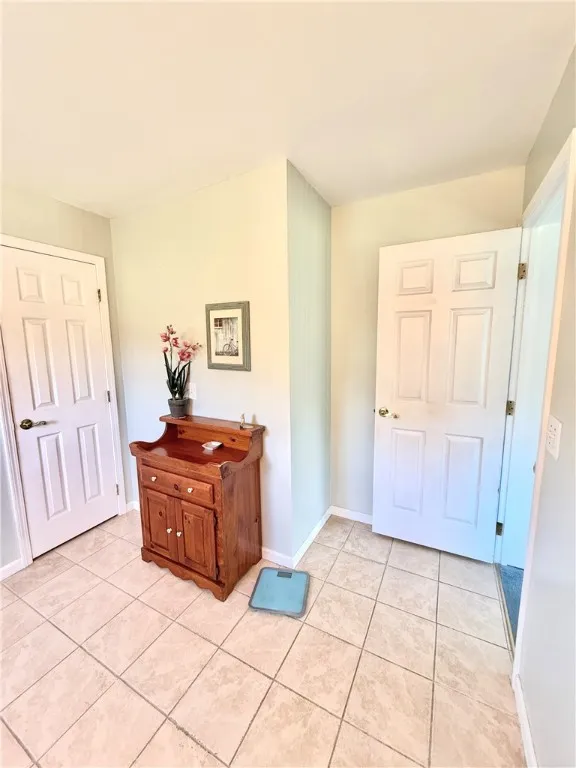Smooth tile flooring in this primary bath.