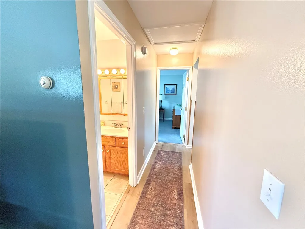 Next hallway leads to second full bath and Bedroom.