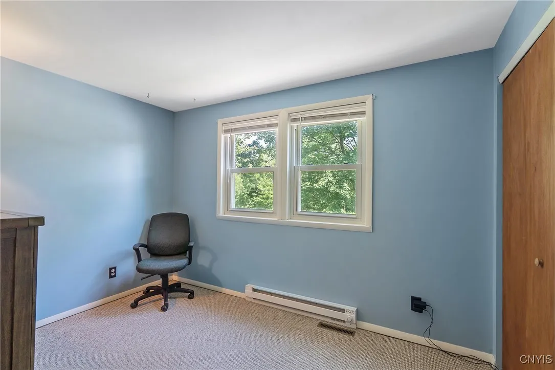 Bedroom #2 offers a fresh feel with brand new sheetrock replacing the old paneling, plus a crisp coat of paint that brings a clean, modern look to this generously sized space.