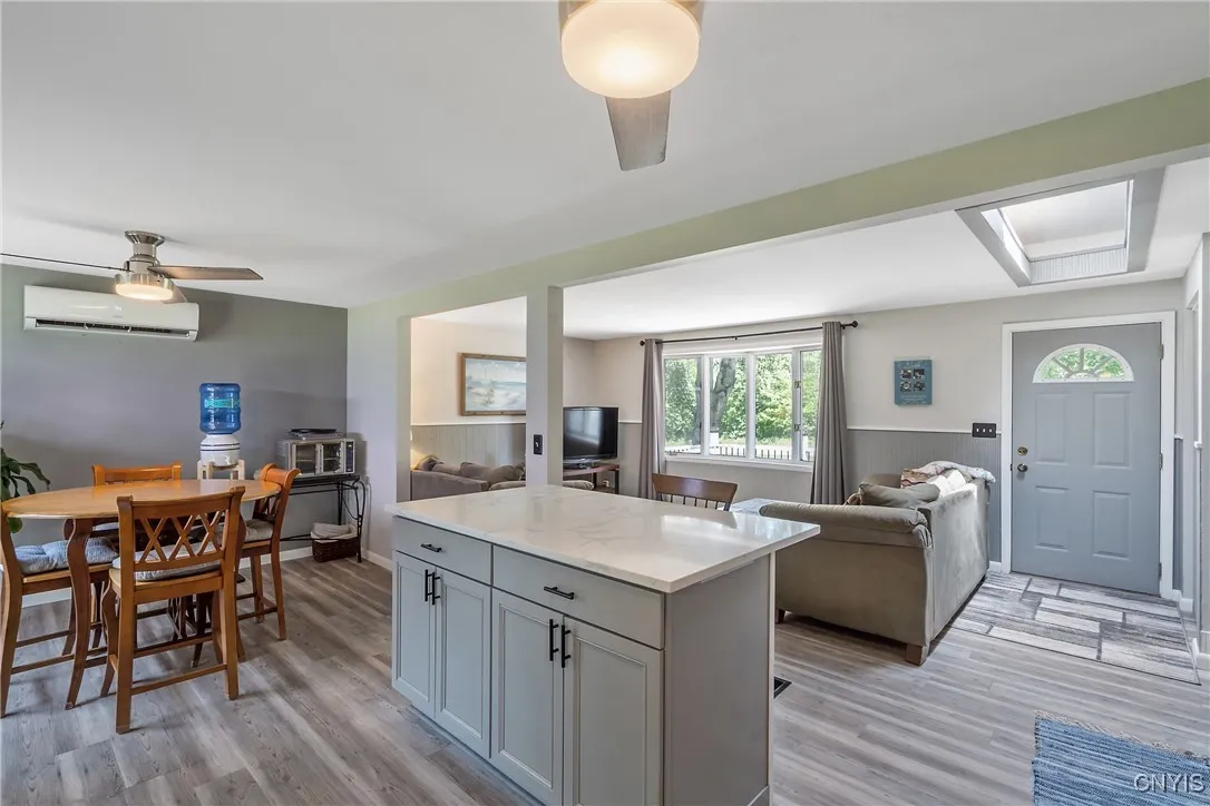 Looking back through the open living room and kitchen, you can really feel how spacious and inviting this area is. And with a cute eat-in nook just off to the left, there’s plenty of room for everyone to gather, laugh, and enjoy good times together!