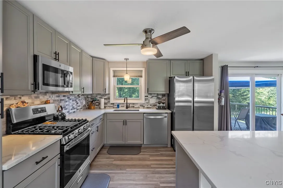 As you step into the kitchen, you’ll notice the gleaming new appliances, all part of a complete kitchen remodel finished in 2022—fresh, modern, and ready for your favorite recipes.