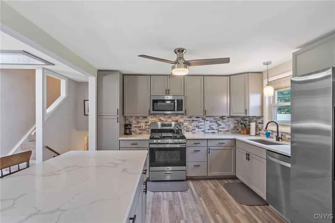 Love a good kitchen island? Who doesn’t! This one won’t disappoint—featuring gleaming new quartz countertops and plenty of space to gather, prep, and serve all at once.