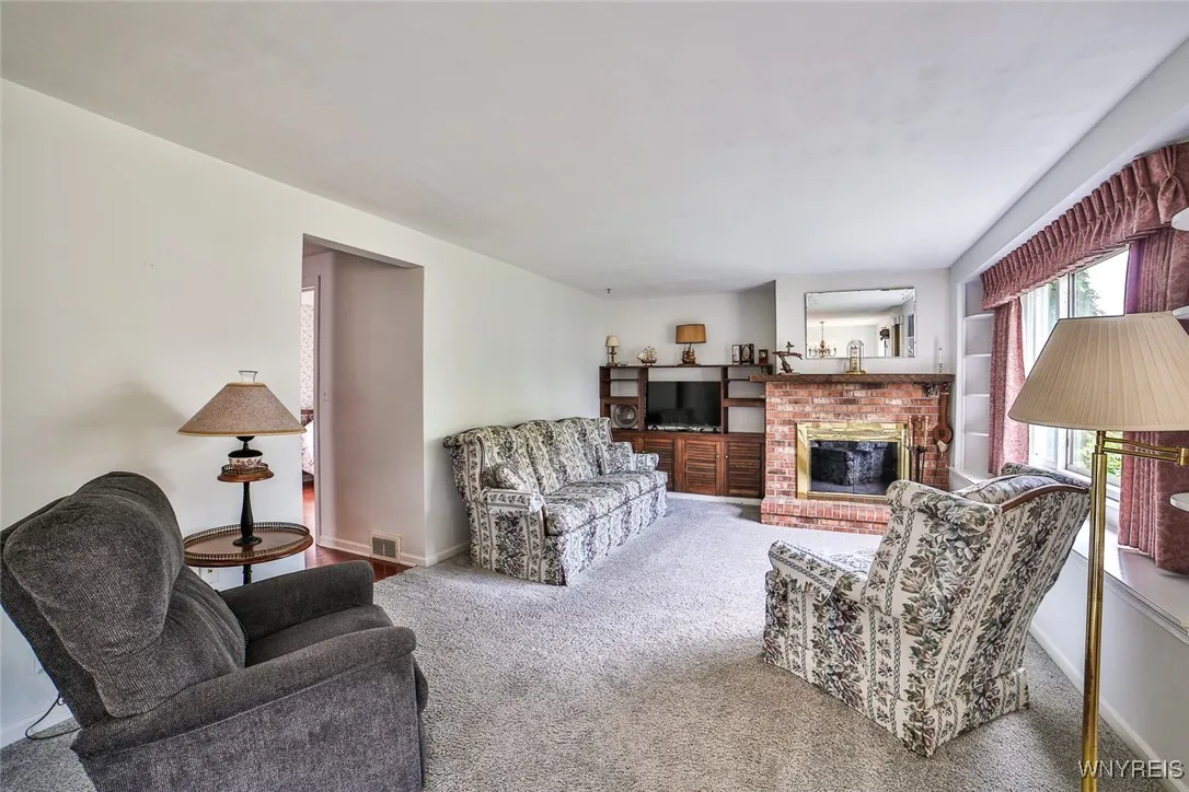 Enjoy the gas fireplace on chilly nights. The built-ins to the left of the fireplace make for a great entertainment space with storage.