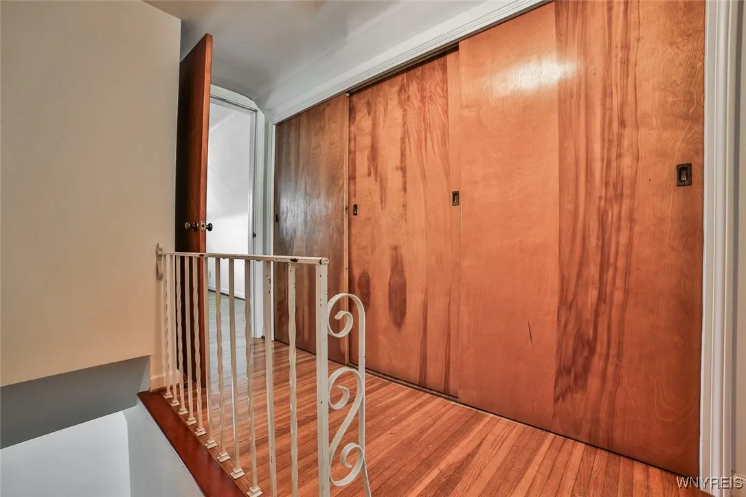 A full wall of closets greats you at the top of stairs to the second floor.