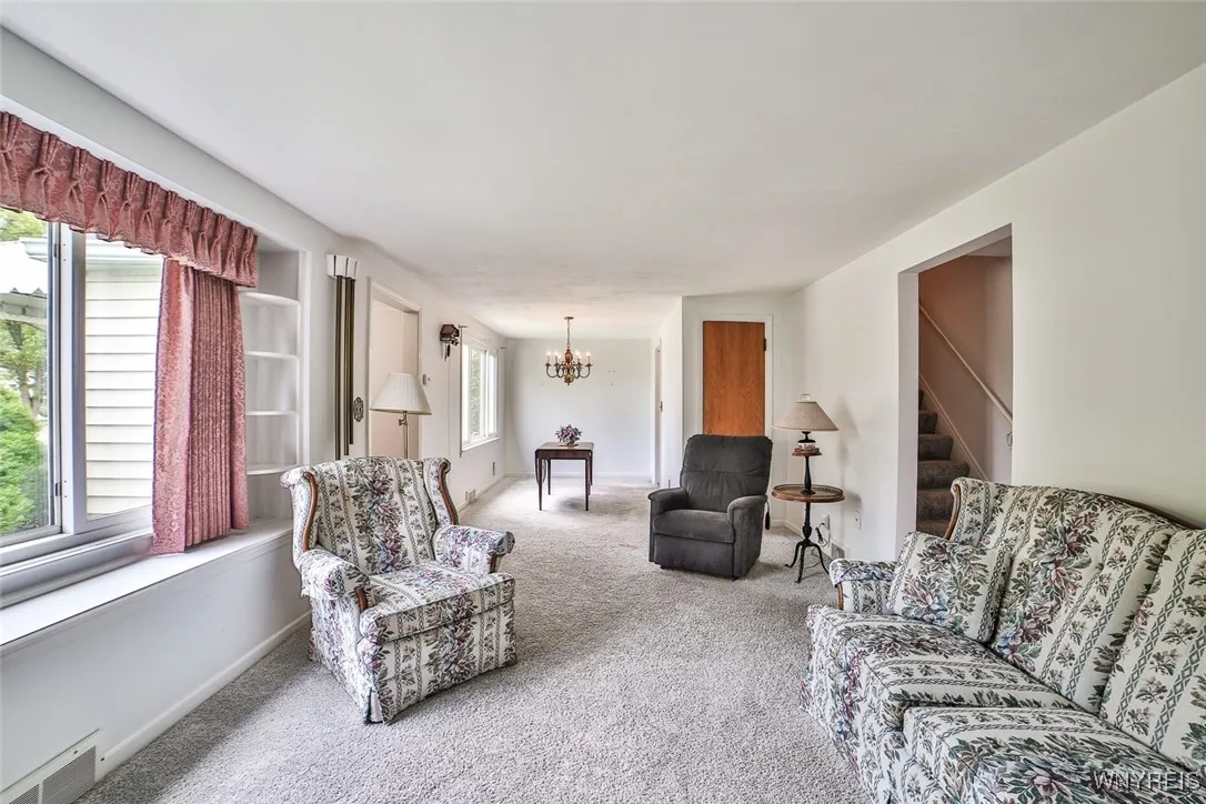 There is an open floor plan between the living and dining rooms. Both of these rooms are flooded with natural light.