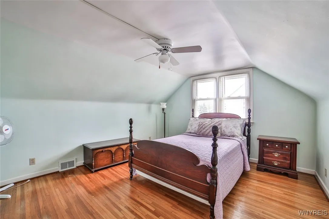 This nice sized bedroom on the second floor has pretty hardwood floors.