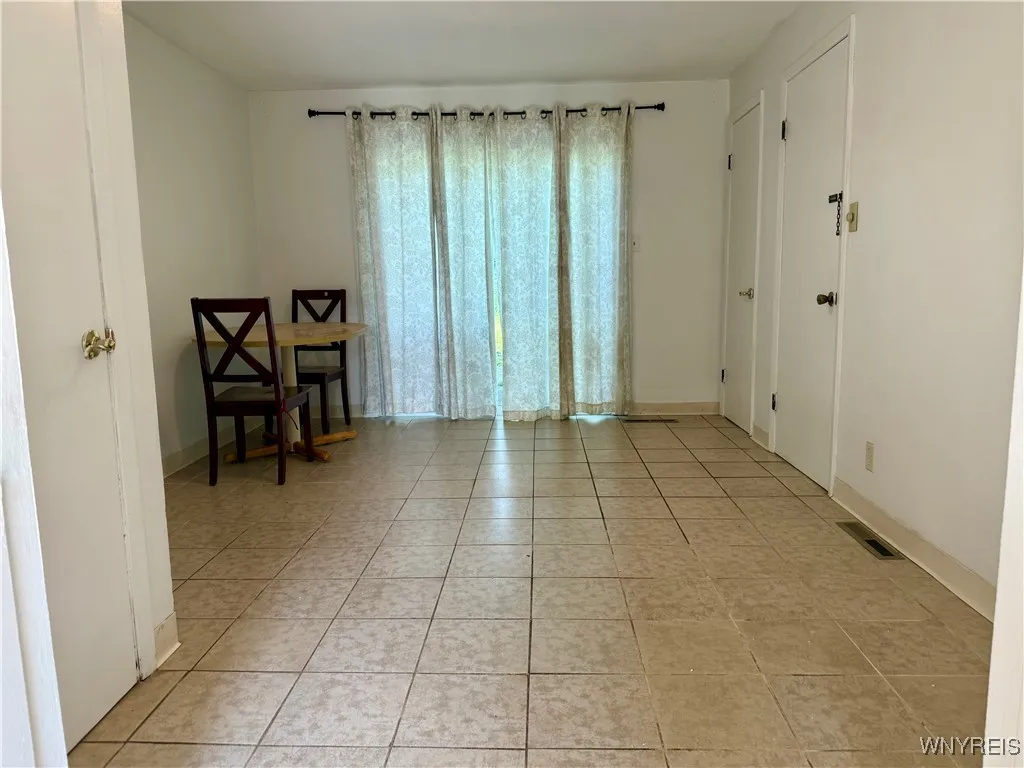Family room with sliding glass doors that lead to patio