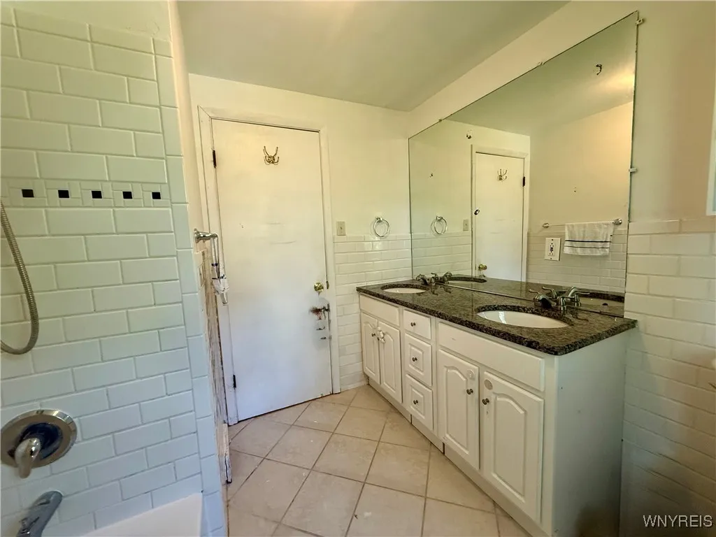 Full bath - accent ceramic tiles around tub