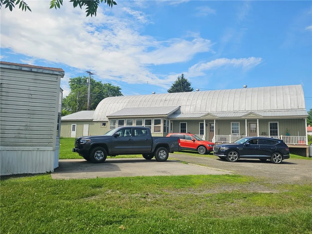 Rear view apartments and singlewide
