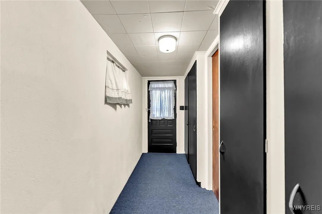 Basement built in storage cabinets with walk out access to extrior